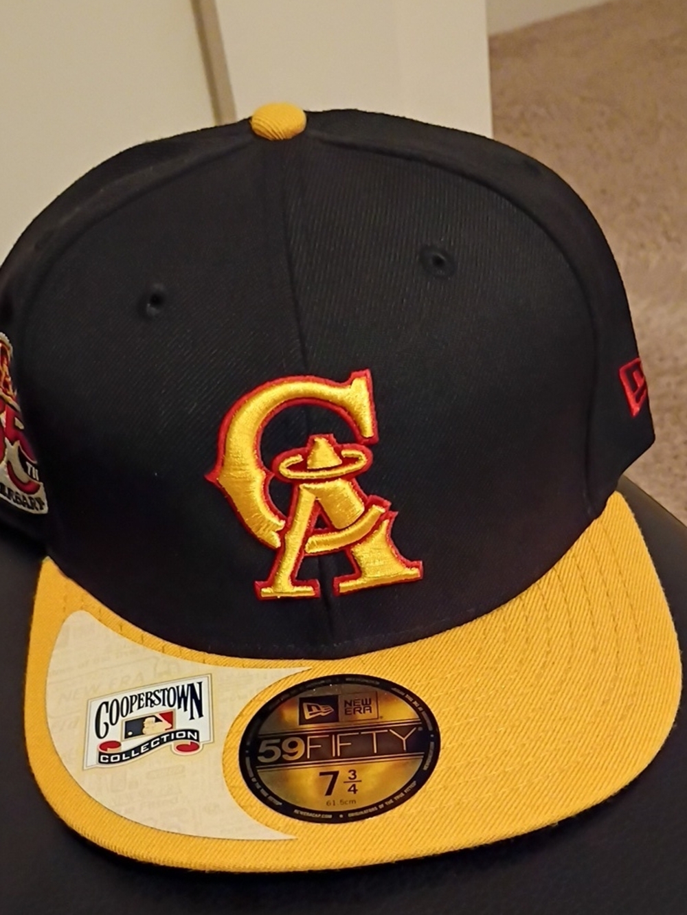 New Era Black and Gold Fitted Cap with Embroidered CA Logo